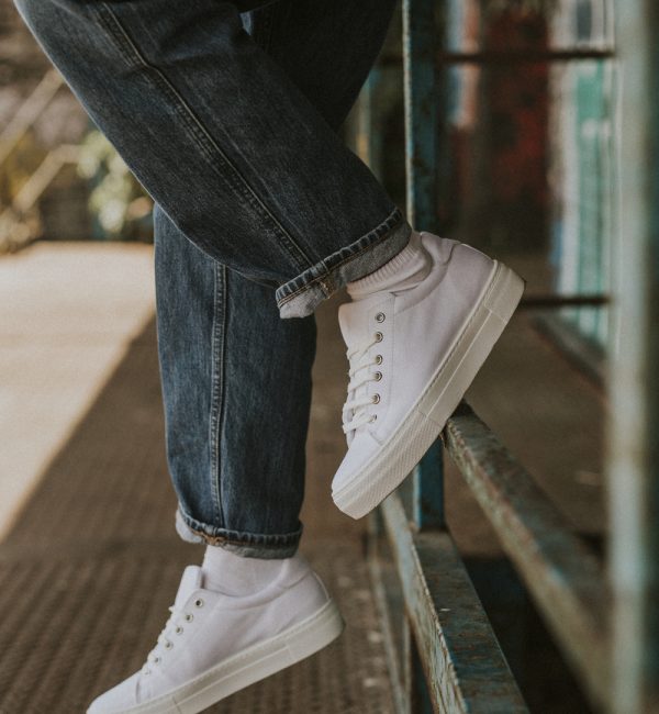 White sneakers on woman model